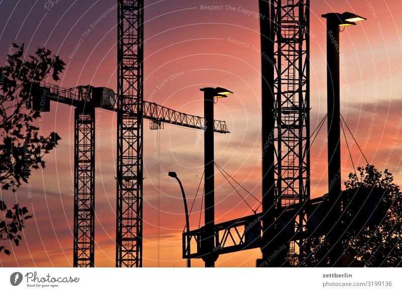 dusk Evening Construction site slewing crane Dark Twilight Closing time Worm's-eye view large construction site Heaven Industrial construction Crane Deserted