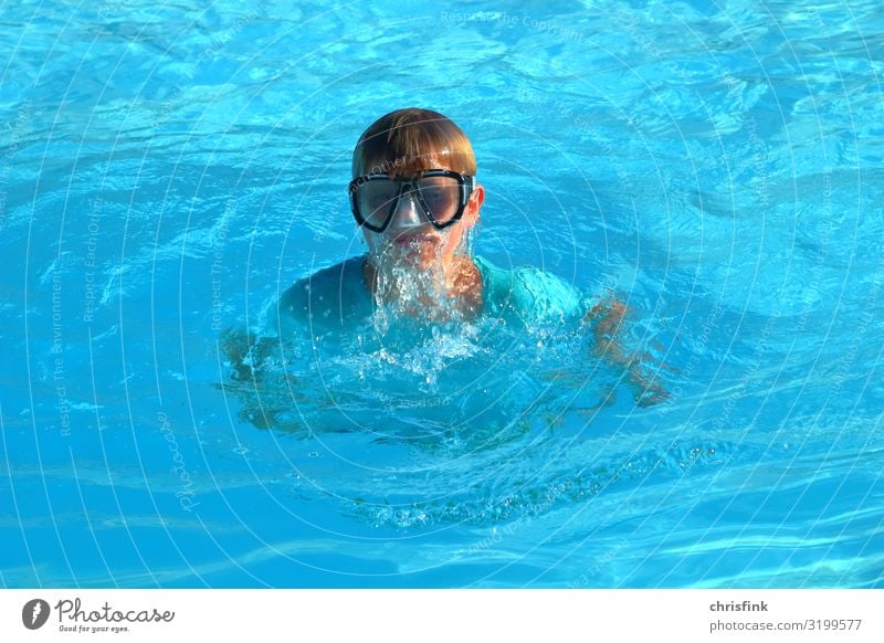Boy with diving goggles in swimming pool Lifestyle Leisure and hobbies Vacation & Travel Tourism Sports Swimming & Bathing Dive Parenting Boy (child)