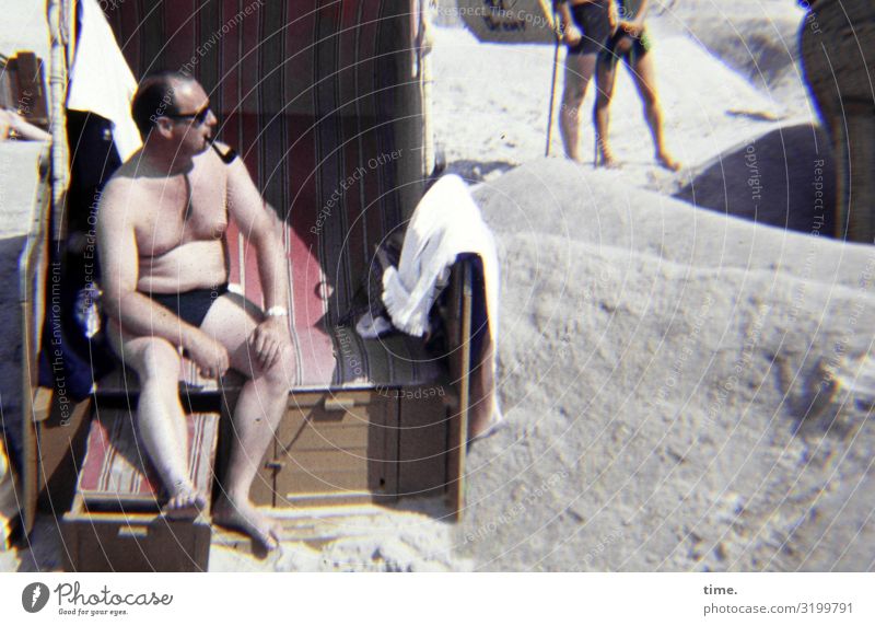 lord of a castle Masculine Man Adults 1 Human being Beautiful weather Coast Beach Swimming trunks Sunglasses Pipe Observe Smoking Looking Sit Hot Bright
