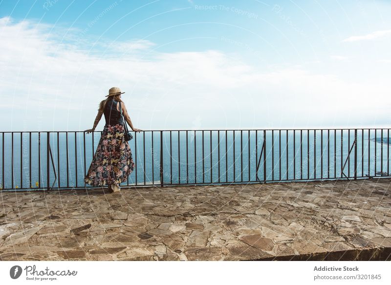 Stylish woman on terrace of seashore Woman seascape Style Summer Terrace Modern Fence Coast Vacation & Travel Contentment Leisure and hobbies Beautiful Idyll