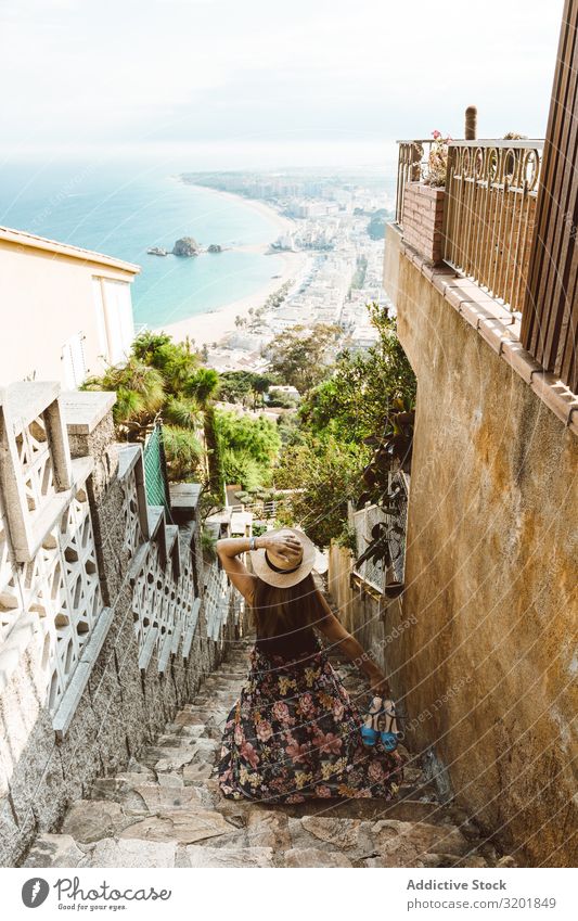 Stylish woman picturing coast from stairway Woman seascape City Vacation & Travel explore Tourism Summer Stairs Street Stone Style Nature Vantage point Coast