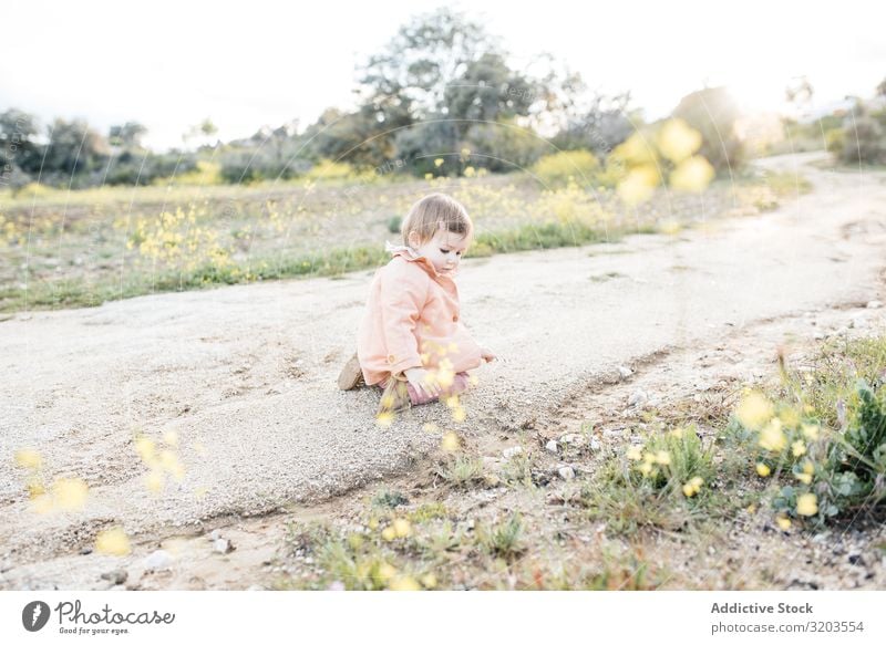 Adorable toddler girl on roadside Girl Baby Nature Strange Rural explore Small Street Rock Toddler Happy Child Infancy Cute Playful Sweet Summer Touch Sit