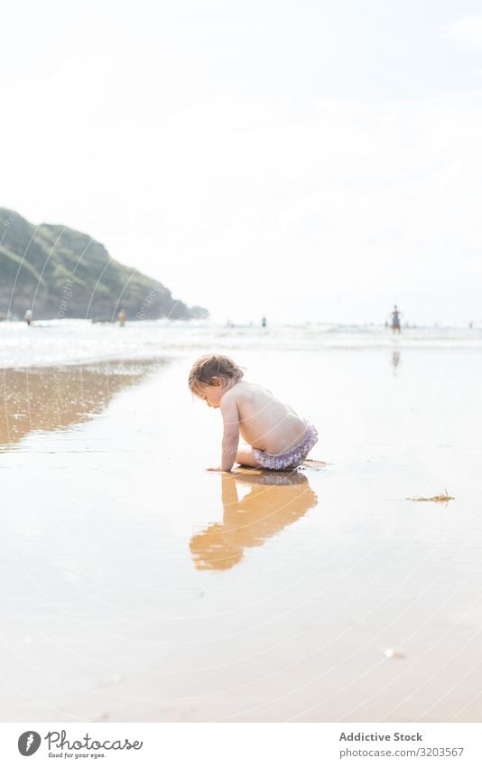 Toddler baby on wet sunny beach Baby Beach Sunlight Summer Coast Child Water Innocent Vacation & Travel Leisure and hobbies Playing Rest Joy Nature Beautiful