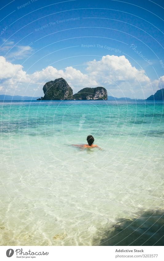 Traveler swimming in turquoise ocean water Vacation & Travel Float in the water Paradise Beach Thailand Water Relaxation Clear Lagoon Calm Tropical Summer Ocean