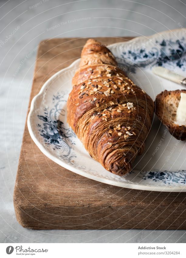 Crispy croissant with grains Croissant crispy Grain Delicious Plate Breakfast Snack Food Roll Tasty Morning Brown Bread Fresh Cooking Sweet Baking whole Diet