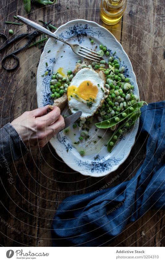 Delicious breakfast meal with steamed peas and egg Breakfast Peas Egg Frying sauteed served Eating Meal Beans Food Fresh Cooking Tradition Wood Raw Vegetable