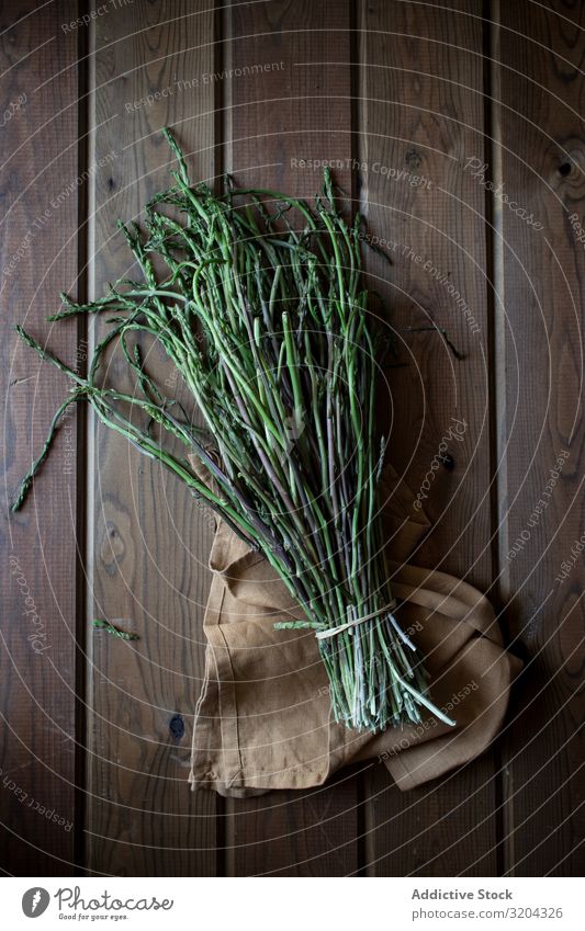 Fresh green asparagus Green Asparagus Organic Natural Food Bundle Cooking Delicious Nutrition Raw Mature Herbs and spices Leaf Rustic Table Vegetarian diet