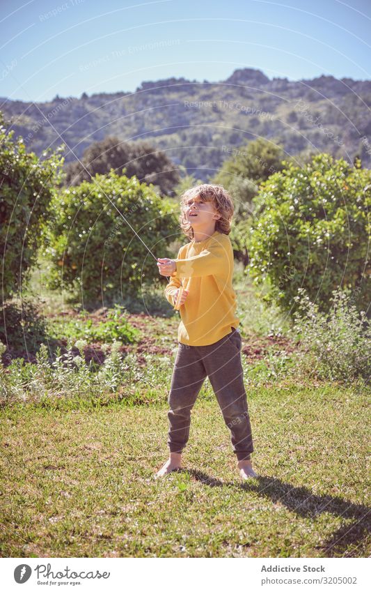 Boy launching kite on summer day Boy (child) Kite Sky Joy Infancy Playing Flying Landscape Child Small Human being Action Playful Easygoing Recklessness