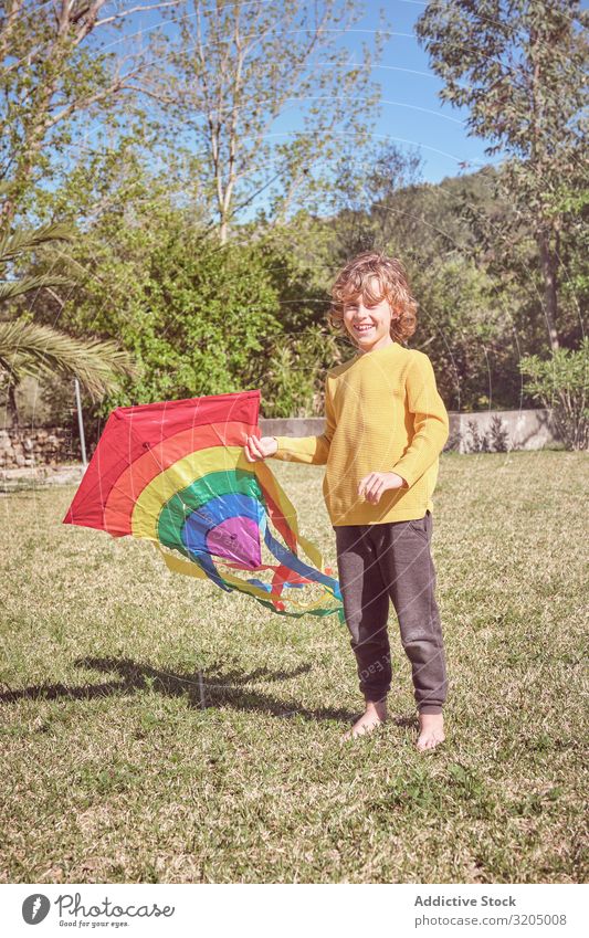 Boy launching kite on summer day Boy (child) Kite Sky Joy Infancy Playing Flying Landscape Child Small Human being Action Playful Easygoing Recklessness