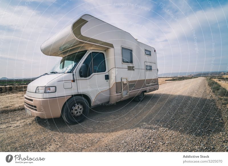 White trailer on empty road along desert Trailer Desert Amazing Empty Street Vacation & Travel Caravan Landscape Nature Speed Asphalt Trip semi Adventure