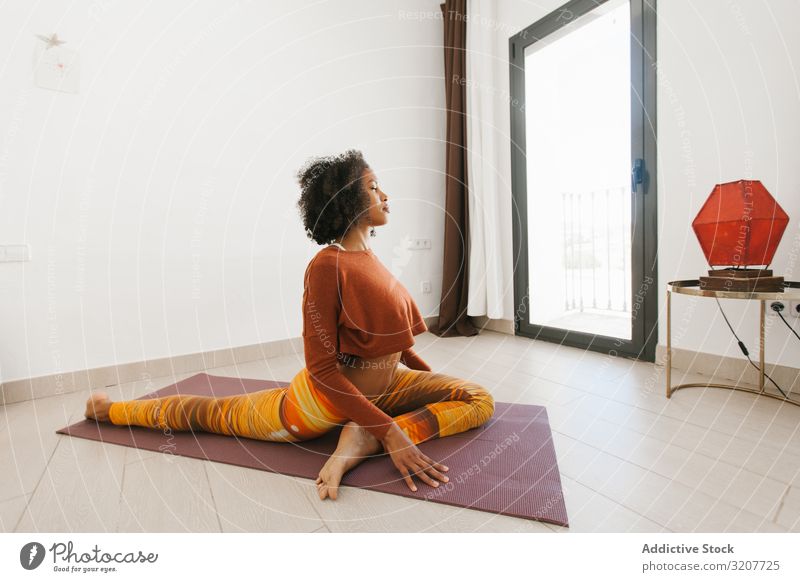 Free Photo  Beautiful woman meditating sitting on yoga mat