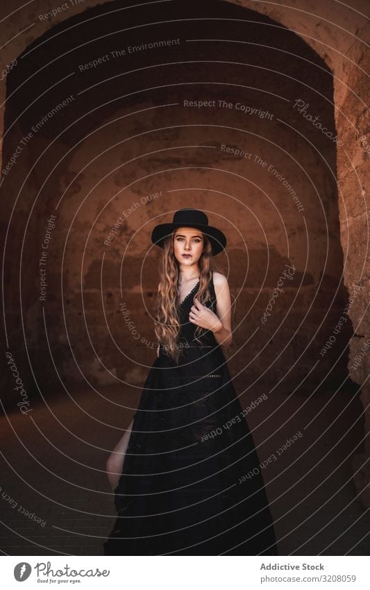 Elegant female in ancient fortress woman fashion stylish trendy glamorous model dress black clothing castle young beautiful pretty attractive elegant