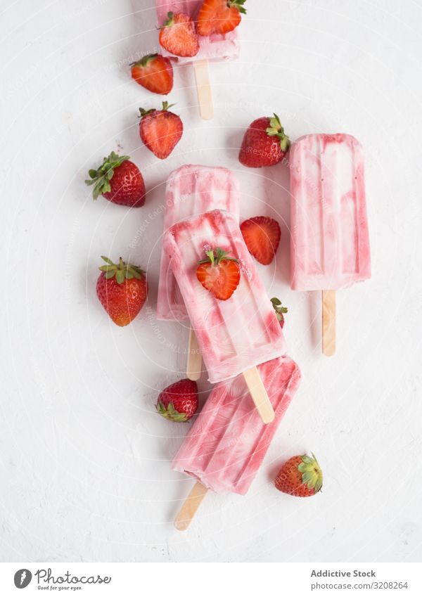Pink popsicles and fresh strawberries ice-cream strawberry pink refreshing freeze pop delicious cold iced summer sweet dessert food fruity homemade snack