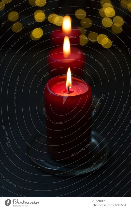 Christmassy mood with 3 red candles Christmas & Advent To enjoy Esthetic Dark Glittering Beautiful Yellow Red Black Emotions Moody Anticipation