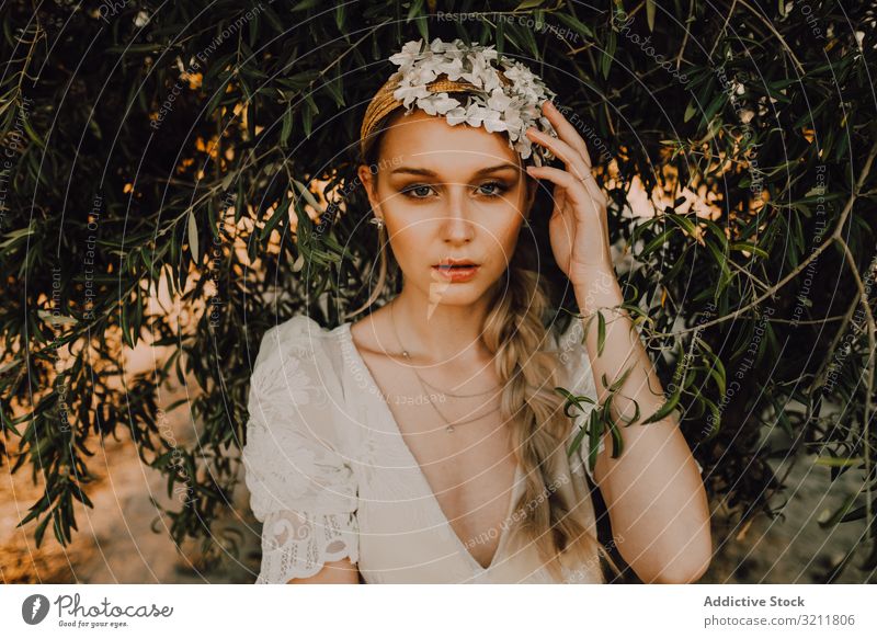 Charming woman in elegant dress near tree bride boho lace wreath flower dream style tender sensual natural summer romantic wedding blonde hippie lifestyle