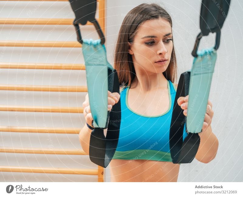 1,200+ Young Athletic Woman Doing Functional Training With Trx Straps Stock  Photos, Pictures & Royalty-Free Images - iStock