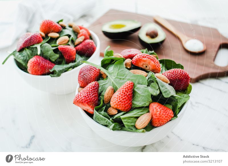 Strawberry served with almond and greenery strawberry avocado delicious food meal gourmet cuisine nutrition dinner spice vegetable vegan vegetarian plate bowl