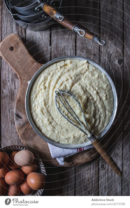 From above baking dish with dough egg whisk wire cooking preparation food cake pie dessert ingredient culinary pan bowl kitchen homemade gourmet delicious