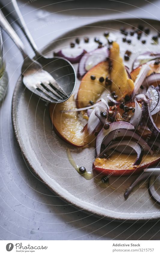 Salad with nectarines and crunchy lentils salad peach onion slice red pepper black food vegetarian delicious healthy fresh tasty gourmet sweet ingredient ripe