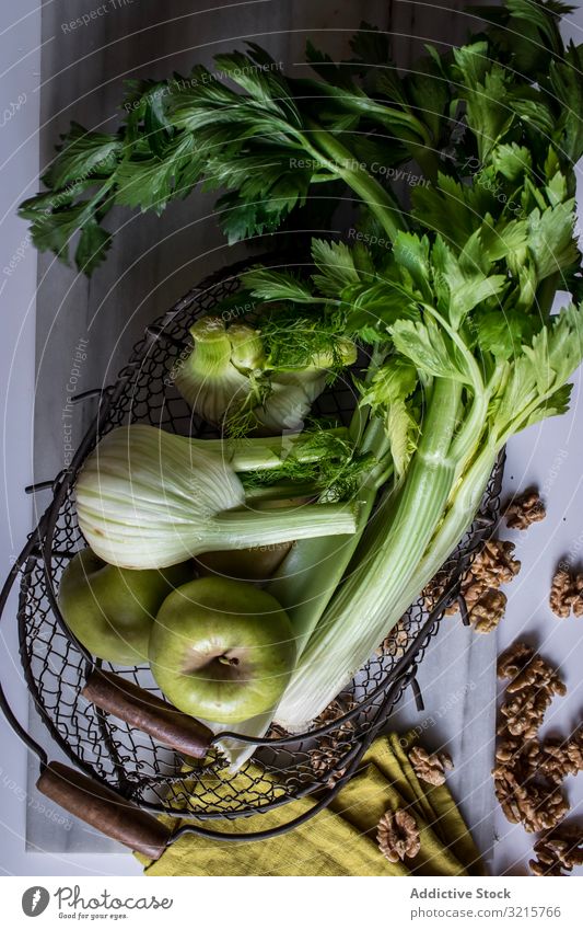 Green vegetables, fruits and nuts for cooking apple celery fennel walnut food basket green raw vegetarian delicious healthy fresh tasty organic gourmet