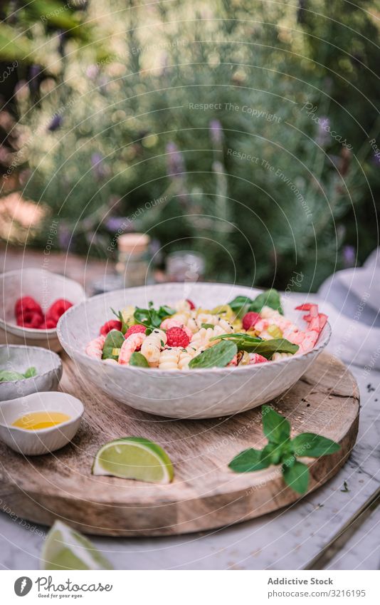 Tasty salad on wooden stand served on decorated table outside tasty meal food healthy dinner berry lime fresh delicious cuisine gourmet vegetable diet dish