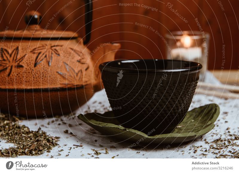 Aromatic tea dates and clay teapot on table leaves herbal drink green hot natural traditional beverage bowl oriental antioxidant gourmet ceremony ramadan teacup