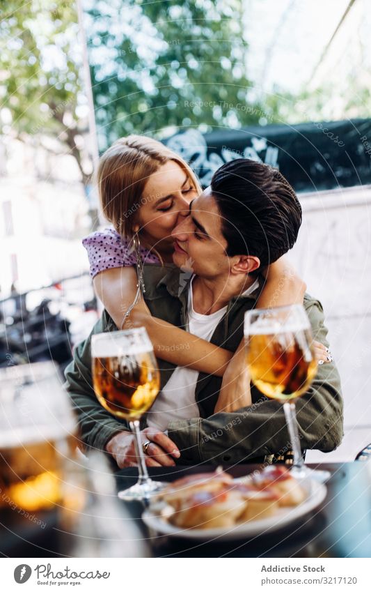 Happy young couple drinking beverages outdoors happy cheerful woman enjoying refreshing walking town beer girlfriend boyfriend love flirting lifestyle dating