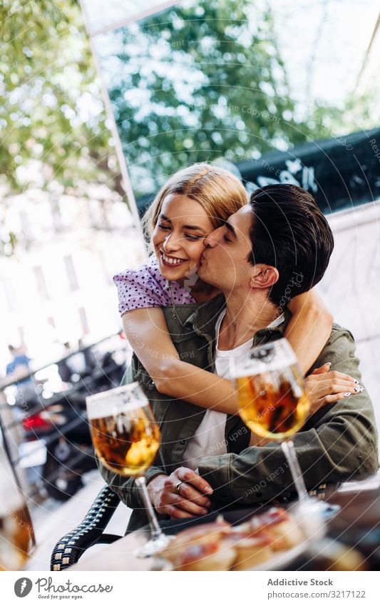 Happy young couple drinking beverages outdoors happy cheerful woman enjoying refreshing walking town beer girlfriend boyfriend love flirting lifestyle dating