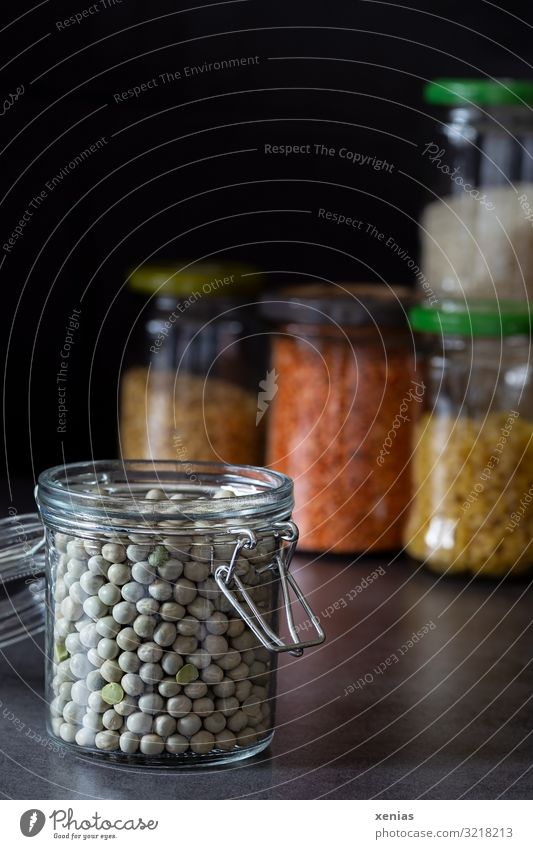 bottled peas in open glass containers in front of other storage jars Peas Preserving jar Supply Noodles Lentils Organic produce Shopping Glass container Modern
