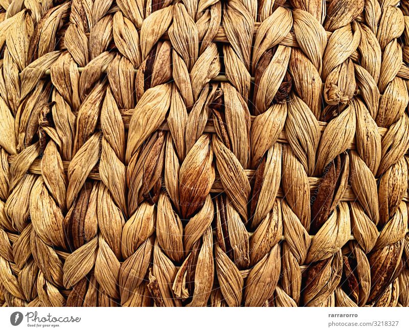 close-up view of a straw basket. Design Handicraft Furniture Craft (trade) Container Braids Wood Old Natural Retro Brown braided Basket wicker knots Self-made