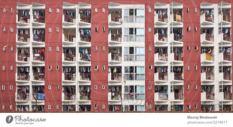Residential apartment building with drying laundry. Lifestyle Living or residing Flat (apartment) House (Residential Structure) House building Town Downtown