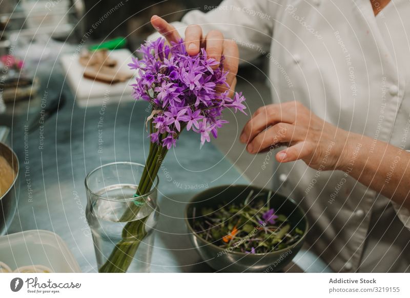 Woman preparing salad by hands at decorated table vegetable green chef dish food fresh dinner red gourmet homemade restaurant organic cooking nutrition tasty