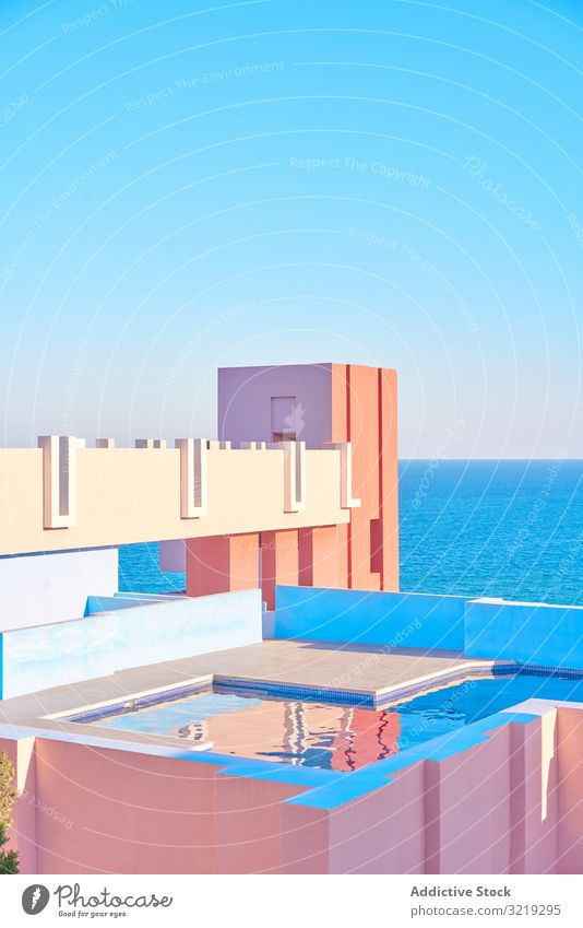Compact pool on roof of building of geometric shapes luxury exterior architecture water tourism travel swimming landmark poolside urban city light cityscape