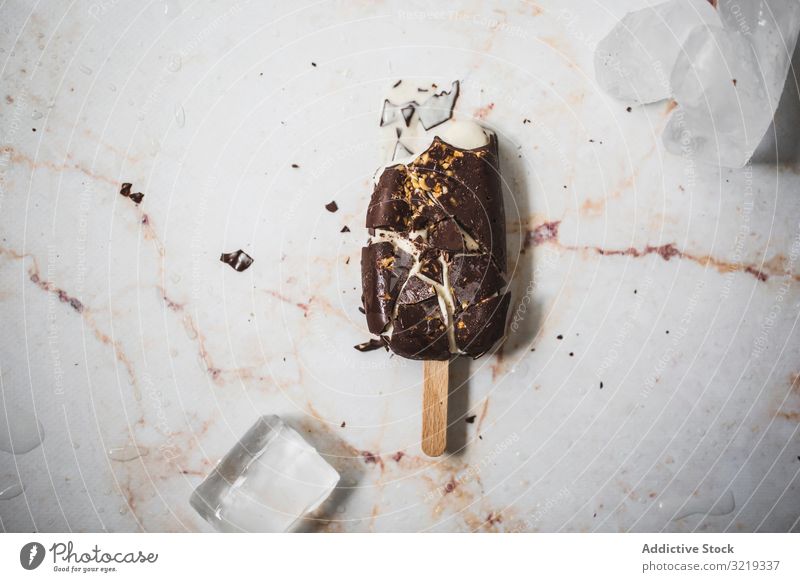 Crashed chocolate and vanilla popsicle Chocolate Ice Cream Vanilla Almond ice cream background summer dessert delicious stick food brown sweet cold tasty flavor