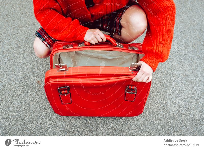 Woman opening suitcase on road woman red travel stylish female luggage hide beautiful bag freedom alone urban trip journey bush enjoyment pleasure model tourist