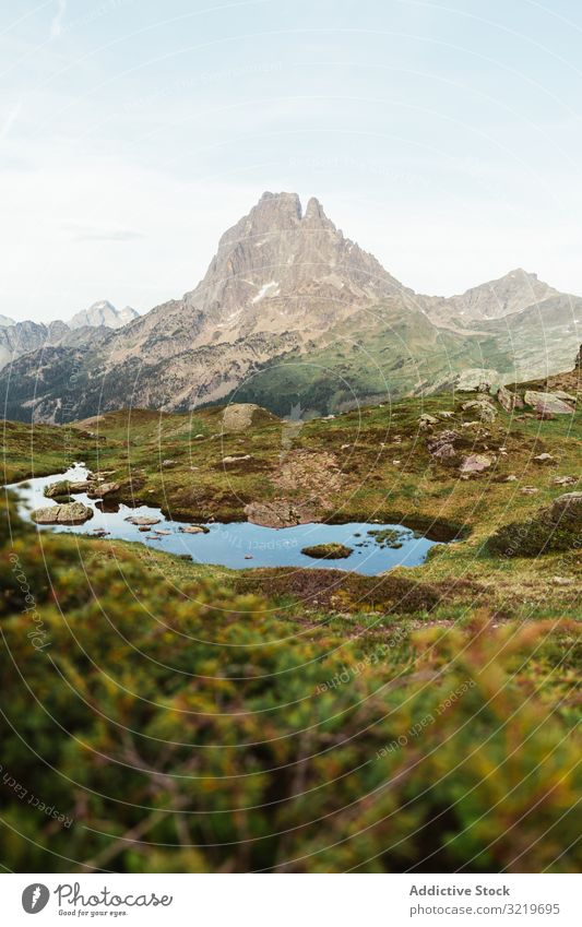 Picturesque view of lake in mountain area pyrenees lawn travel picturesque beautiful calm stony sunny day water landscape summer nature scenic countryside rocky