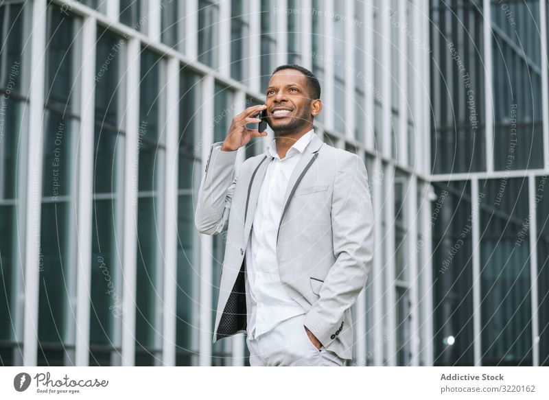 Man Wearing White Suit Walks Stock Photo, Royalty-Free