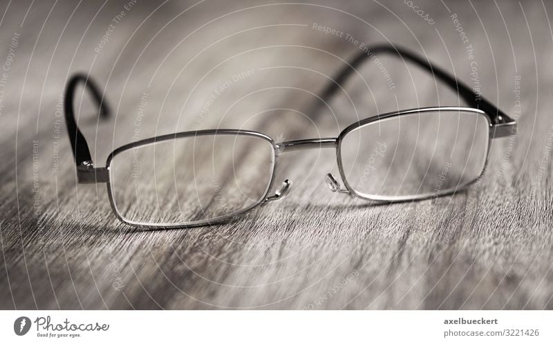 reading glasses Health care Help Eyeglasses Reading glasses Looking Optics Optician Lens visually impaired Sign of old age presbyopia Table Wooden table