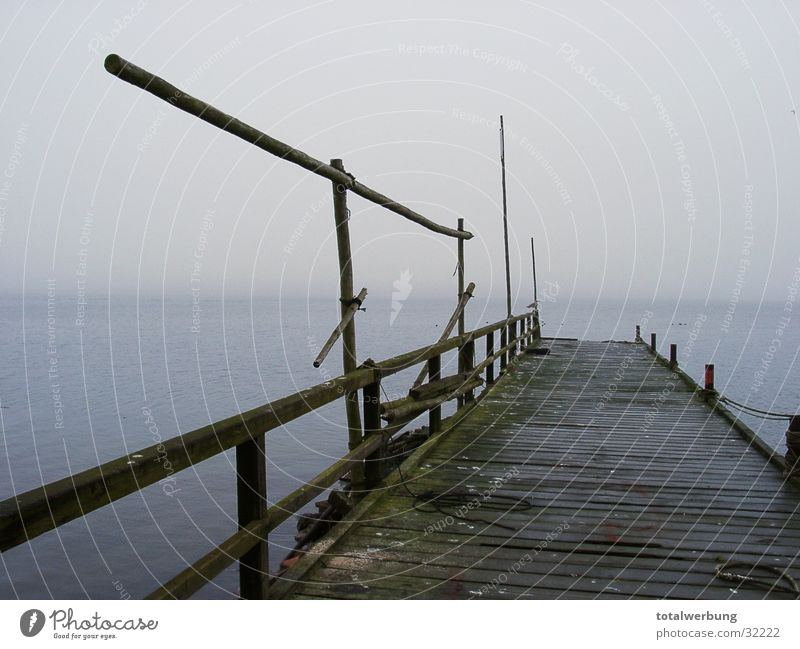 Boat landing stage in the fog Watercraft Footbridge Fog Cold Moody Loneliness Rügen