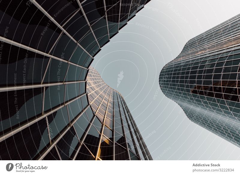 Round geometric building of business center with mirrored walls futuristic architecture development urban construction structure office reflection design