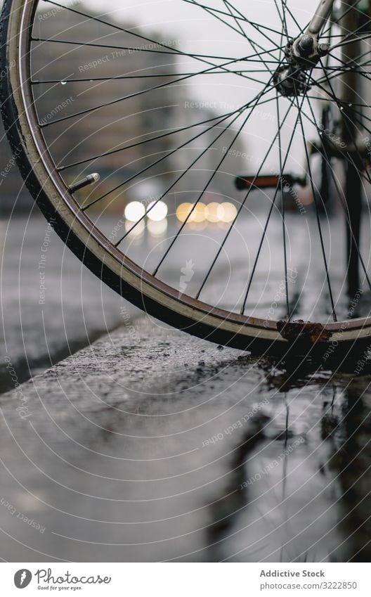 Wet bicycle wheel on road rain architecture activity wet bike cycling travel journey freedom adventure repair vehicle extreme dirty transport traffic waiting