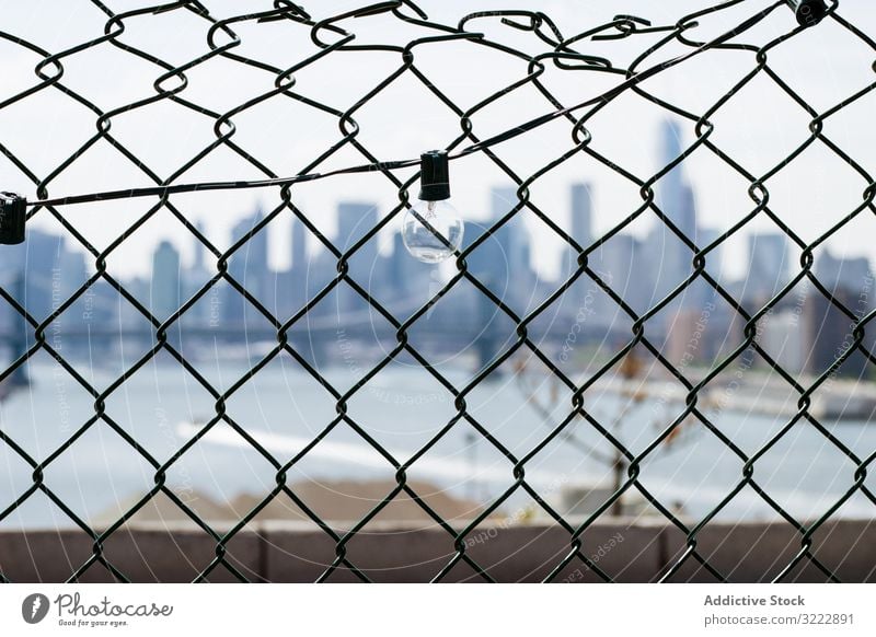 Skyscrapers of New York City through chain link fence new york city landscape cityscape background architecture skyscraper urban nyc usa manhattan america