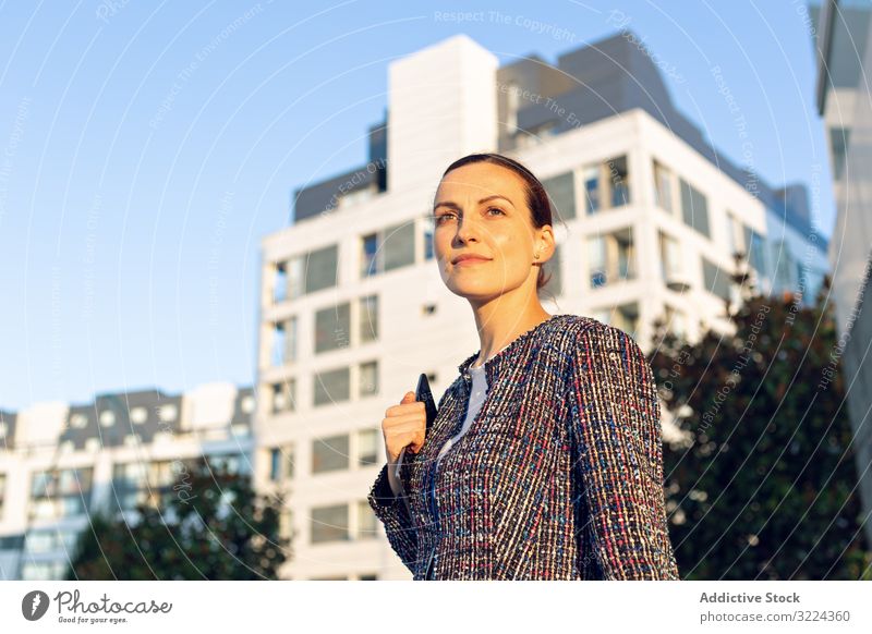 Serious businesswoman leaning on railing building street office serious city elegant modern urban female concerned manager entrepreneur career exterior jacket