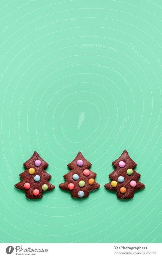 Three cute Christmas tree shaped cookies. Gingerbread cookies Food Cake Dessert Candy Chocolate Winter Decoration Feasts & Celebrations Christmas & Advent