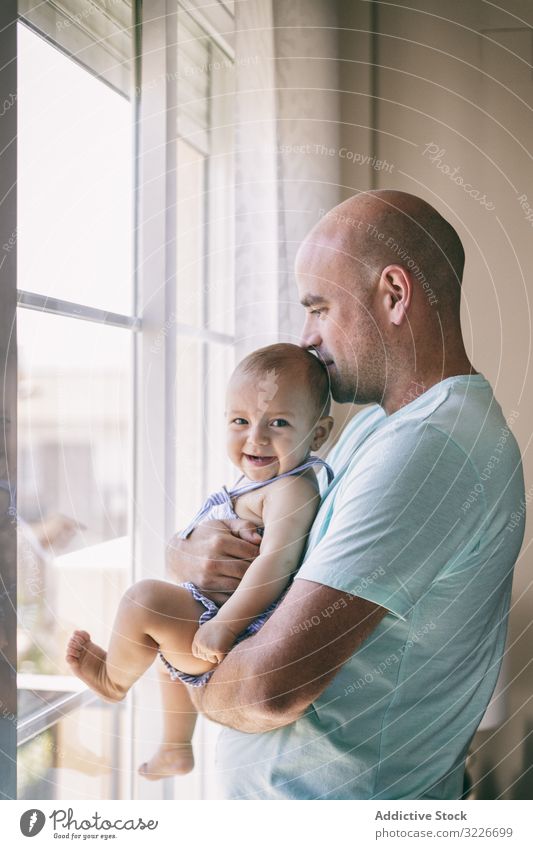 Father With Baby Looking Out Window A Royalty Free Stock Photo From Photocase