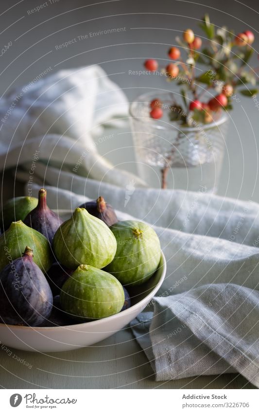 Plate of fresh ripe figs on kitchen table plate autumn colorful bowl harvest wooden berries bright fruit healthy organic sweet appetizer crop selective tasty