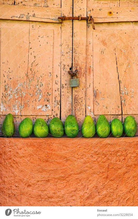 lined mangos placed in a window, trinidad - cuba Fruit Life Island Building Facade Street Sell Fresh Colour Mango exterior Cuba caribe Placed Shutter