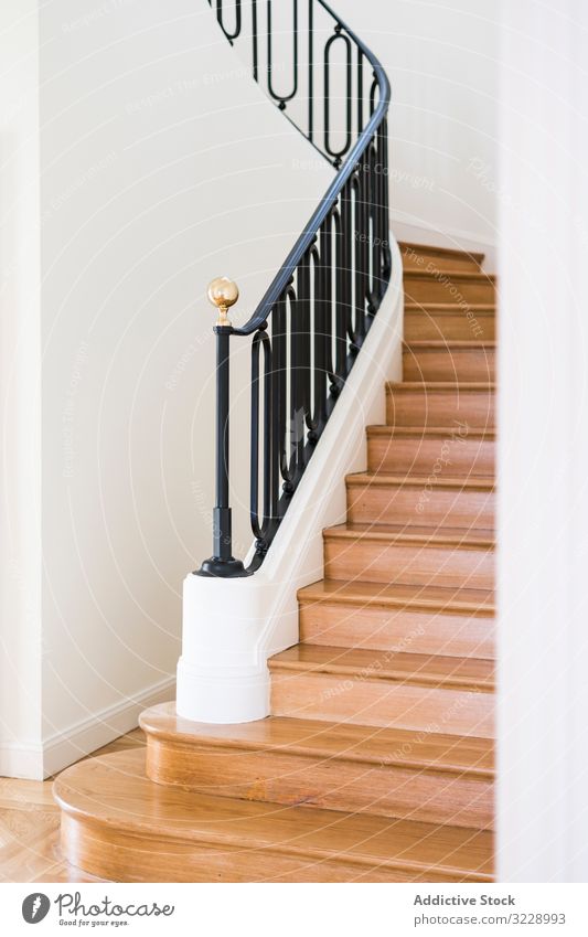 Classic wooden staircase with wide wooden steps classic design villa mansion estate handrail railing house interior light black home new elegant contemporary