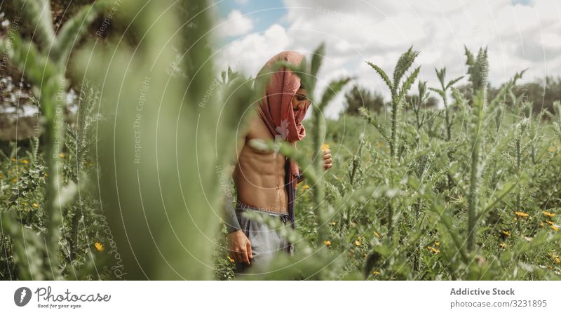 Man training meditating on meadow man mediating concentration relax zen yoga meditation serene focused wellness tranquil peaceful idyllic asana exercise energy