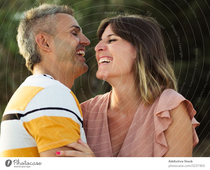 Happy couple looking at each other love smile happy vacation sunny daytime man woman adult honeymoon summer nature shore coast relationship holiday tropical